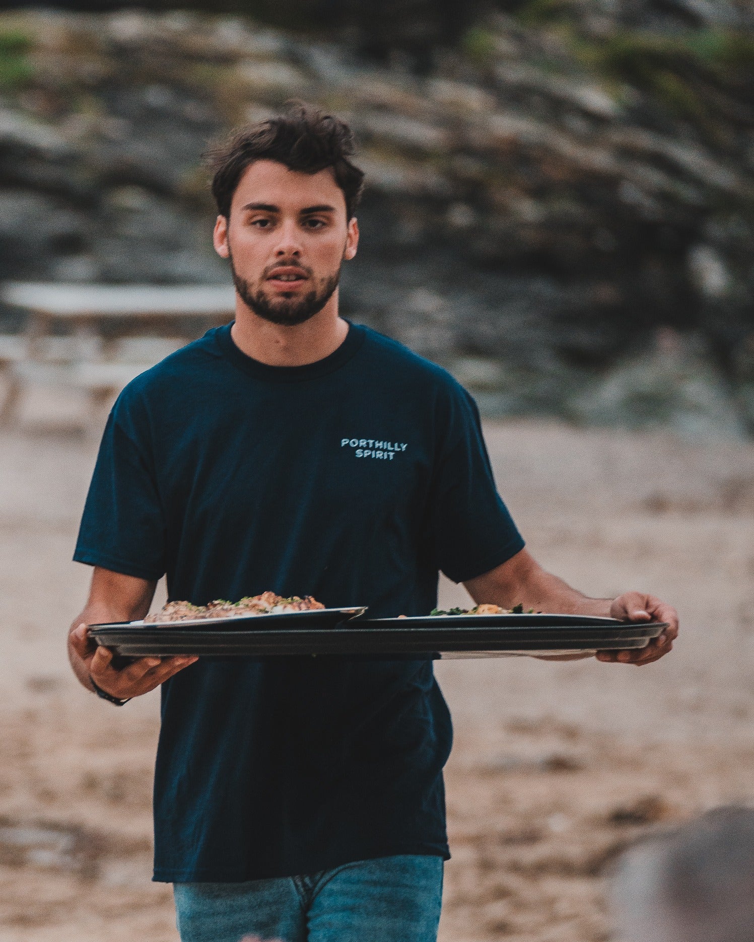 Navy Porthilly Spirit t-shirt worn while serving at a beach feast